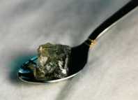 108 ct Rough diamond in a table spoon